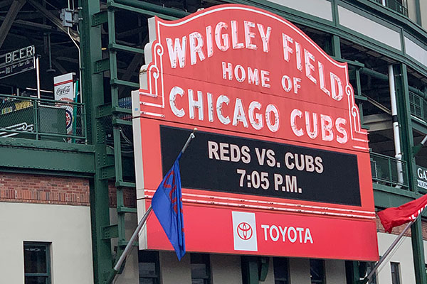 Wrigley Field Marque reads Reds vs. Cubs 7:05 p.m.