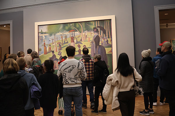 People looking at painting