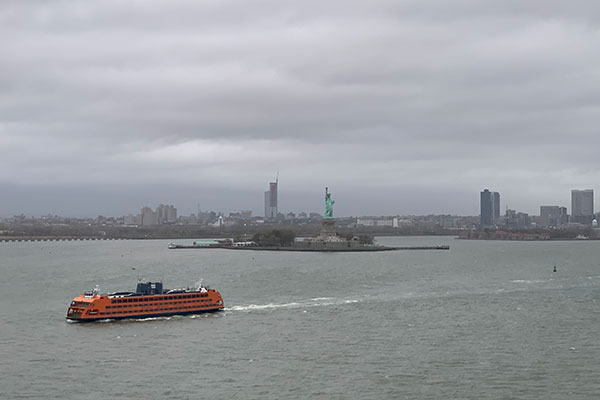 Ferry boat passes Statue of Liberty