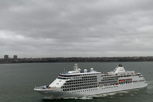 Silver Whisper passes the Regal Princess in New York Harbor