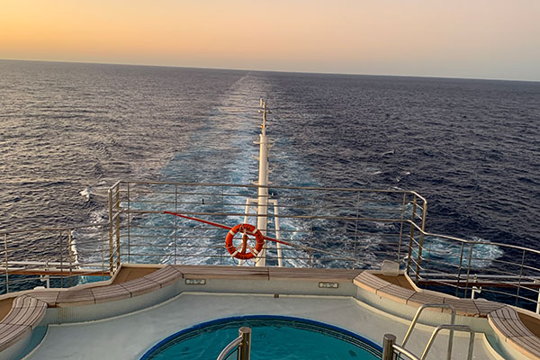 Pool at back of ship during sunset