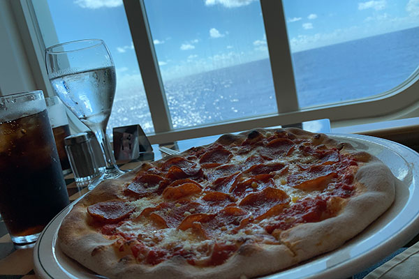 Pizza with window in background 