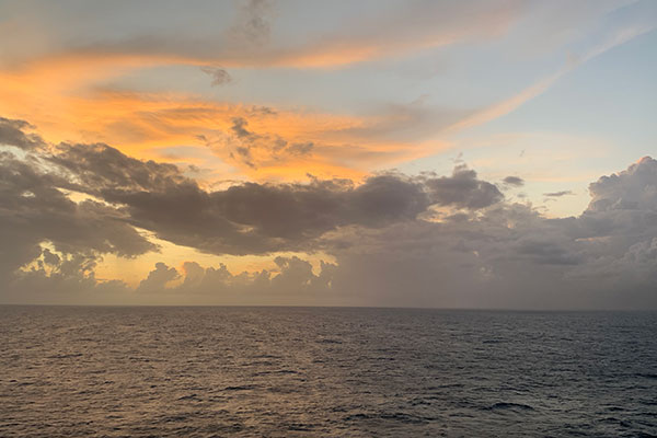 The sun sets over the ocean on November 6