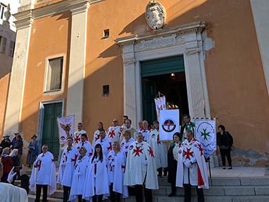 People standing in front of a church