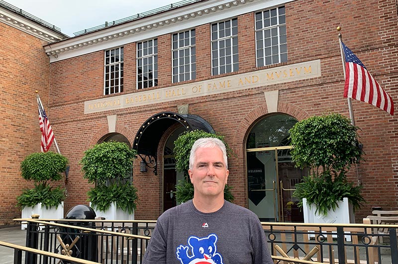 Pat standing in front of the entrance to the Baseball Hall of Fame