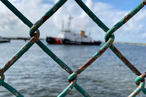 Tugboat behind a fence