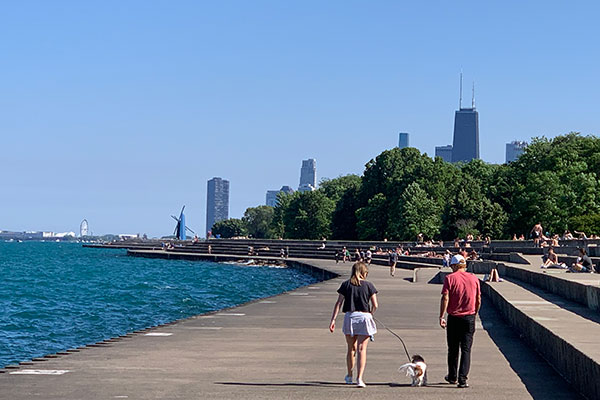 People walking along lake