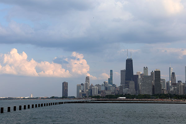 Puffy clouds beyond skyline