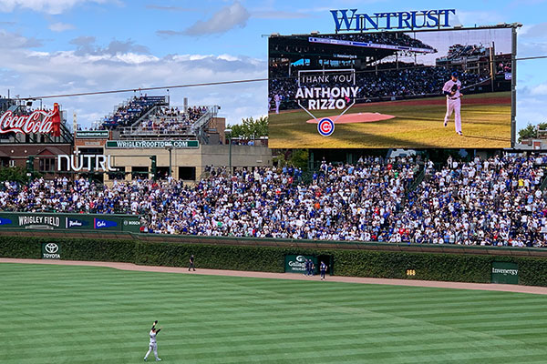 Anthony Rizzo waves to crowd while being honored