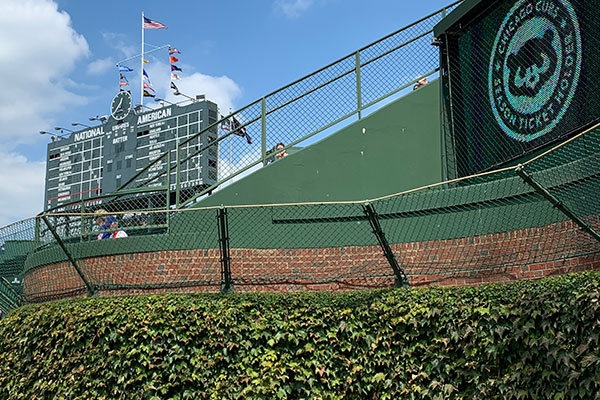 Scoreboard in the distance as viewed from warning track