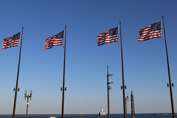 Flags with lighthouse in distance