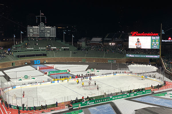 Ice rink on Wrigley Field with scoreboard and video screen behind it