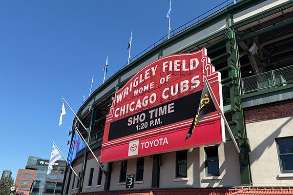 Wrigley Field scoreboard reads Shotime 1:20 p.m.