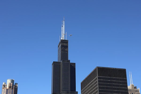 Plane flying over buildings
