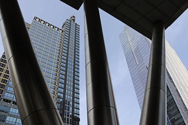 Three building support columns with South Branch of Chicago River