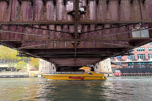 Seadog boat passes under bridge on Chicago River