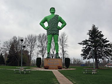 Jolly Green Giant Statue with picnic tables in front