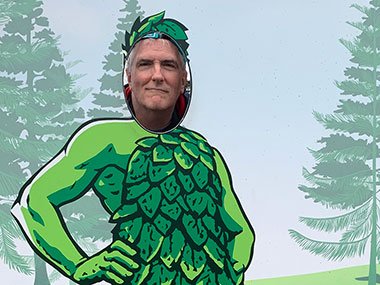 Pat in cut out of Jolly Green Giant