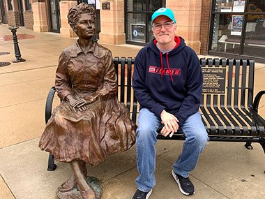 Pat sitting next to Marion Ross statue