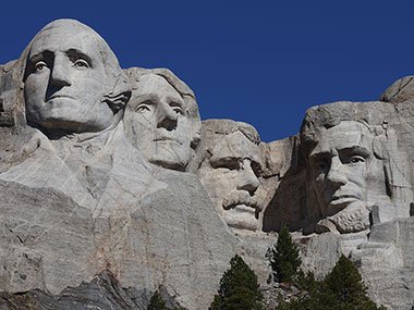 Mount Rushmore through trees