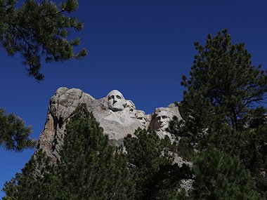 Mount Rushmore outlined in trees