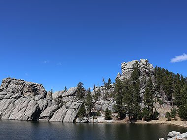 Rocks beyond lake at Custer State Park