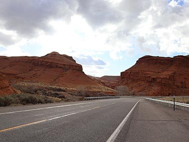 Road leads between red rocks
