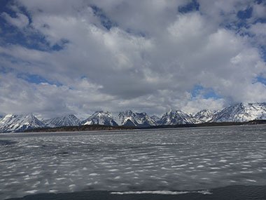 Clouds over mountain with Jenny Lake in foreground