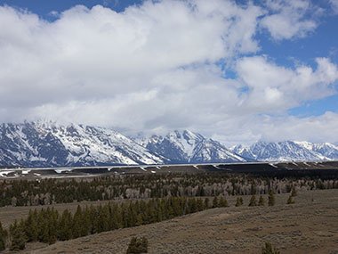 Grand Teton National Park mountains with field in front