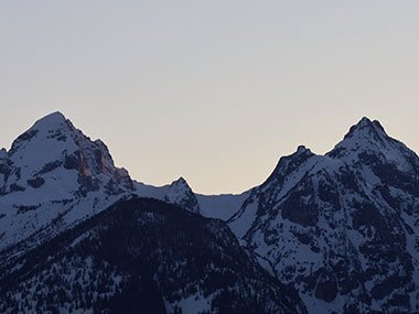 Grand Teton National Park mountains covered with snow at sunset