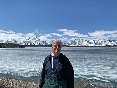 Frozen lake, mountains, and clouds