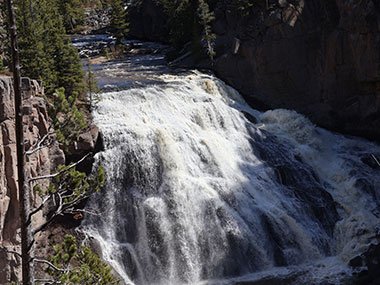 Sun shines on waterfall - Yellowstone National Park