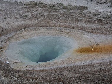 Clear water over geyser pool
