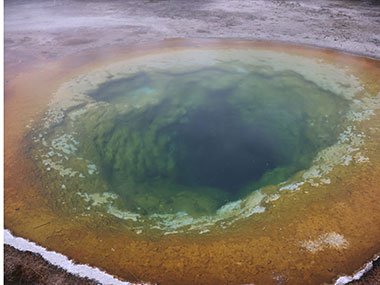 Deep blue pool with red sediment