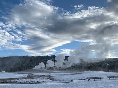 Yellowstone National Park - Old Faithful Geyser early morning after snow