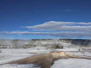 Yellowstone National Park geyser basin covered in snow