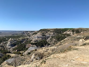 Theodore Roosevelt National Park cliffs under blue sky
