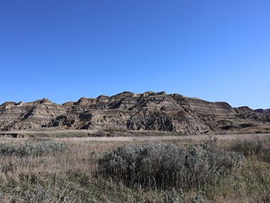 Theodore Roosevelt National Park grassy area with hills beyond