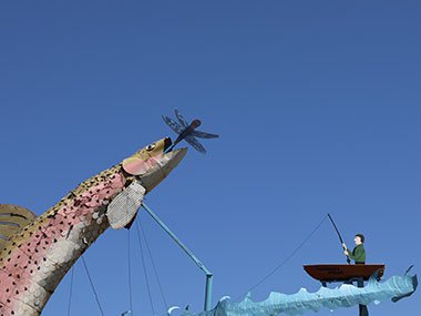 Fish and fisherman in Fisherman's Dream sculpture