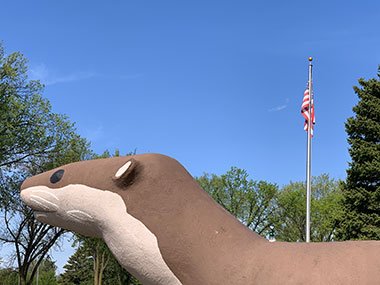 World's Largest Otter with flag flying behind