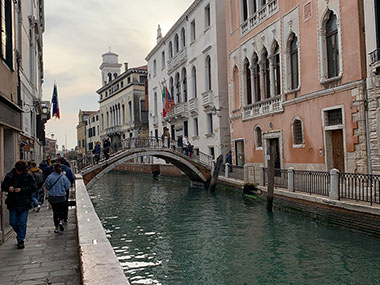 People walking along canal