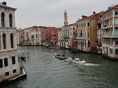 A couple boats passing in canal