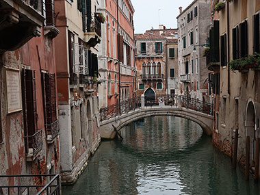 Bridge reflects in water of canal