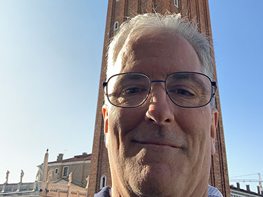 Pat selfie with bell tower in background