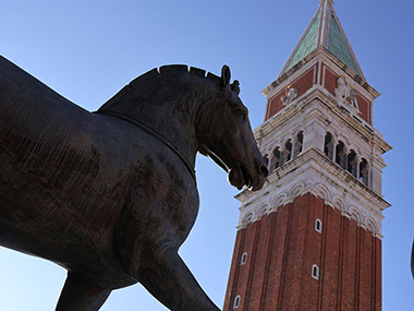 Horse statue in front to bell tower