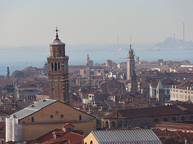 Venice industry in the distance beyond the town and water