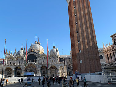 People pass in St. Mark's Square