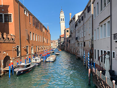 Canal with bell tower in distance