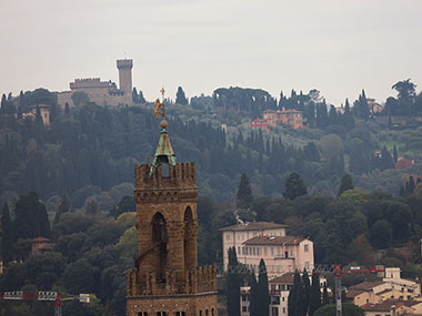 Statues on top of building in distance