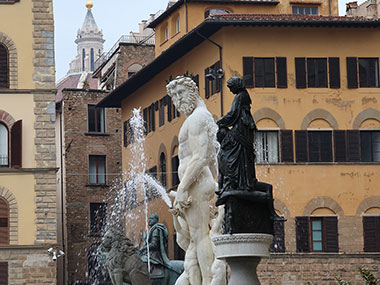 Statues with fountain spraying water